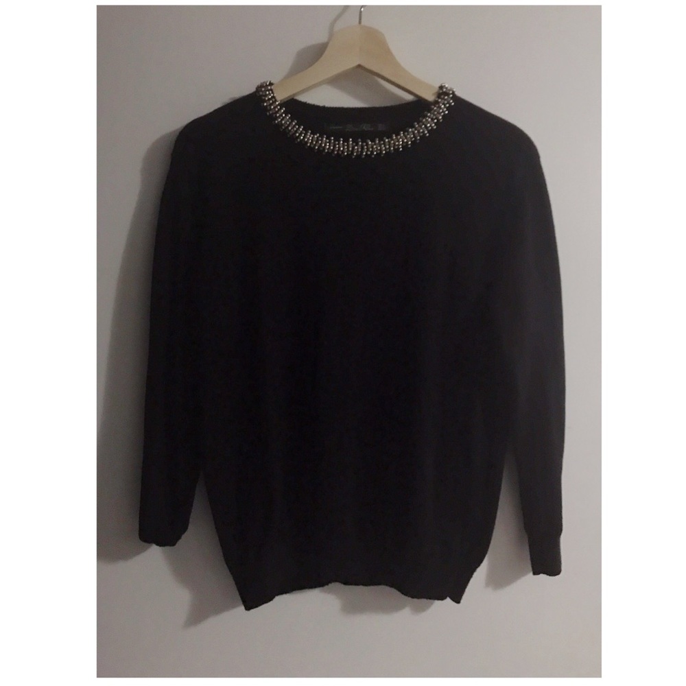 Sweater with embellishment